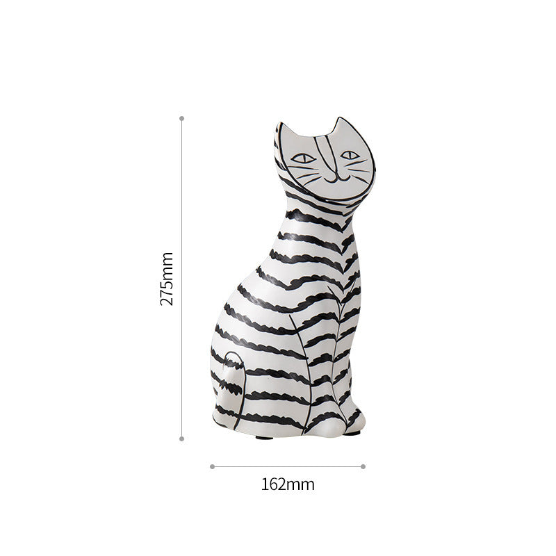 Ceramic black and white striped cat like decoration