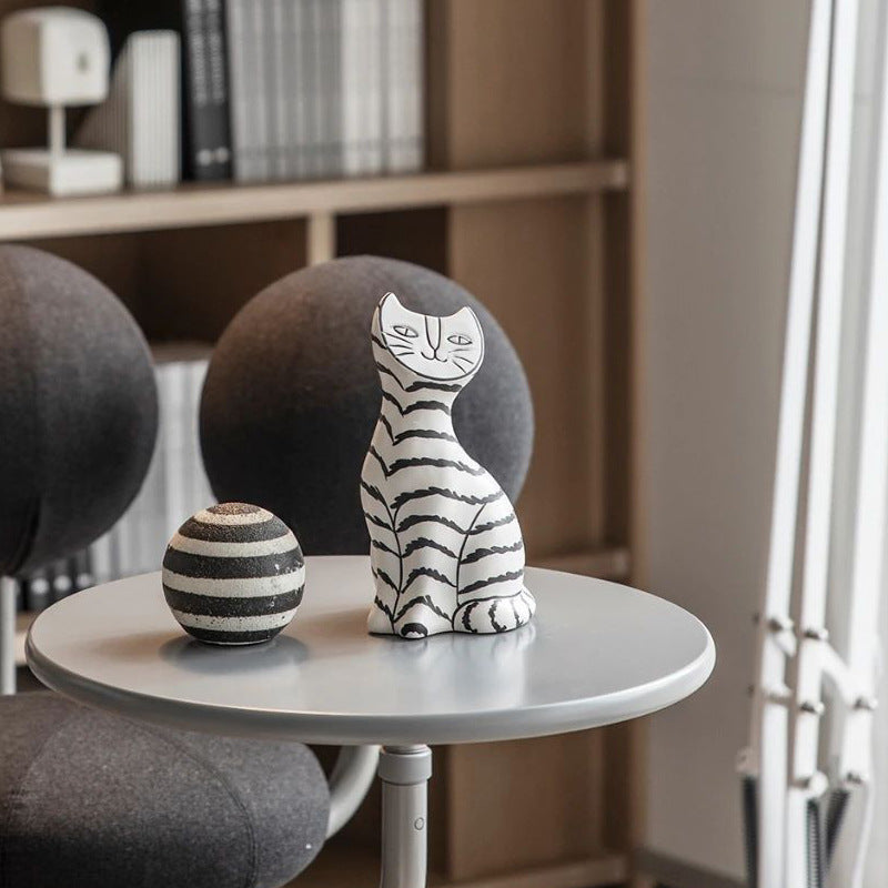 Ceramic black and white striped cat like decoration